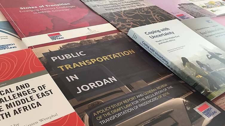 The covers of the publications show topics such as public transport in Jordan, young people in the Middle East and North Africa, and political challenges in MENA countries.